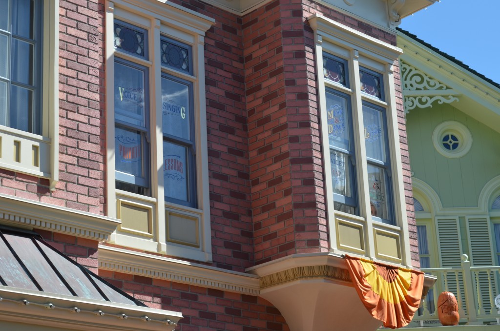 This window on Main Street USA is open and you can hear sounds coming from inside.